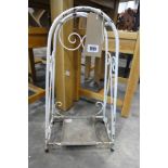 Small white metal umbrella stand