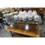 Wrought metal framed coffee table with glass surface