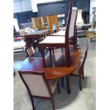 Stained hardwood circular extending dining table with 6 matching beige upholstered dining table,