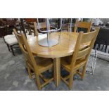 Pine oval dining table with 4 matching dining chairs