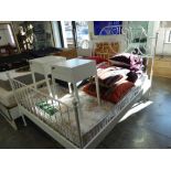 Wrought metal style double bedstead with floral mattress