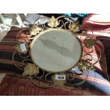 Brass finish framed circular wall mirror