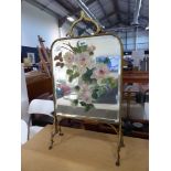 Brass framed fireside screen with rose painted decoration on bevelled mirror