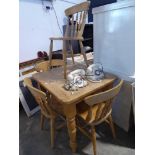 Reproduction pine kitchen table on turned supports with set of 4 beech Windsor chairs