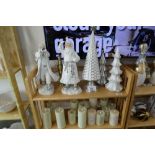 +VAT 5 shelves of Christmas related ornaments including candles, penguins, presents etc.