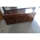 Oriental hard wood entertainment stand with 3 central drawers and 2 small cupboards