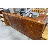 Oriental hard wood sideboard with 2 central doors flanked by 6 drawers