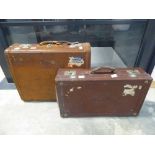 2 vintage brown leather suitcases, 1 marked 'P.E.W.'