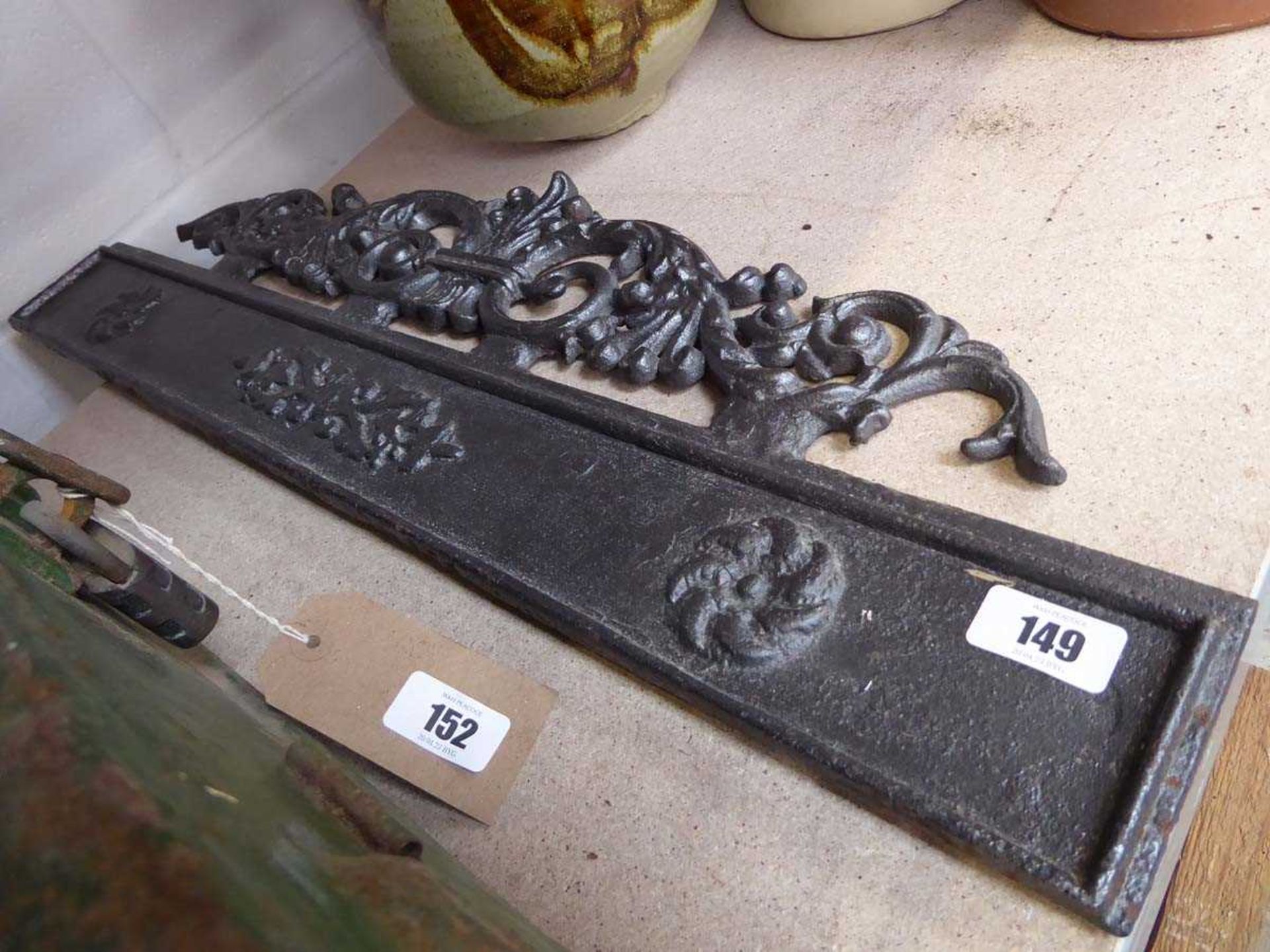 Grey painted cast iron back plate with flour-de-lis motif