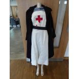 Early 20th century nurses British Red Cross society uniform, including blouse, overall and overcoat