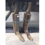 2 wooden boot jacks