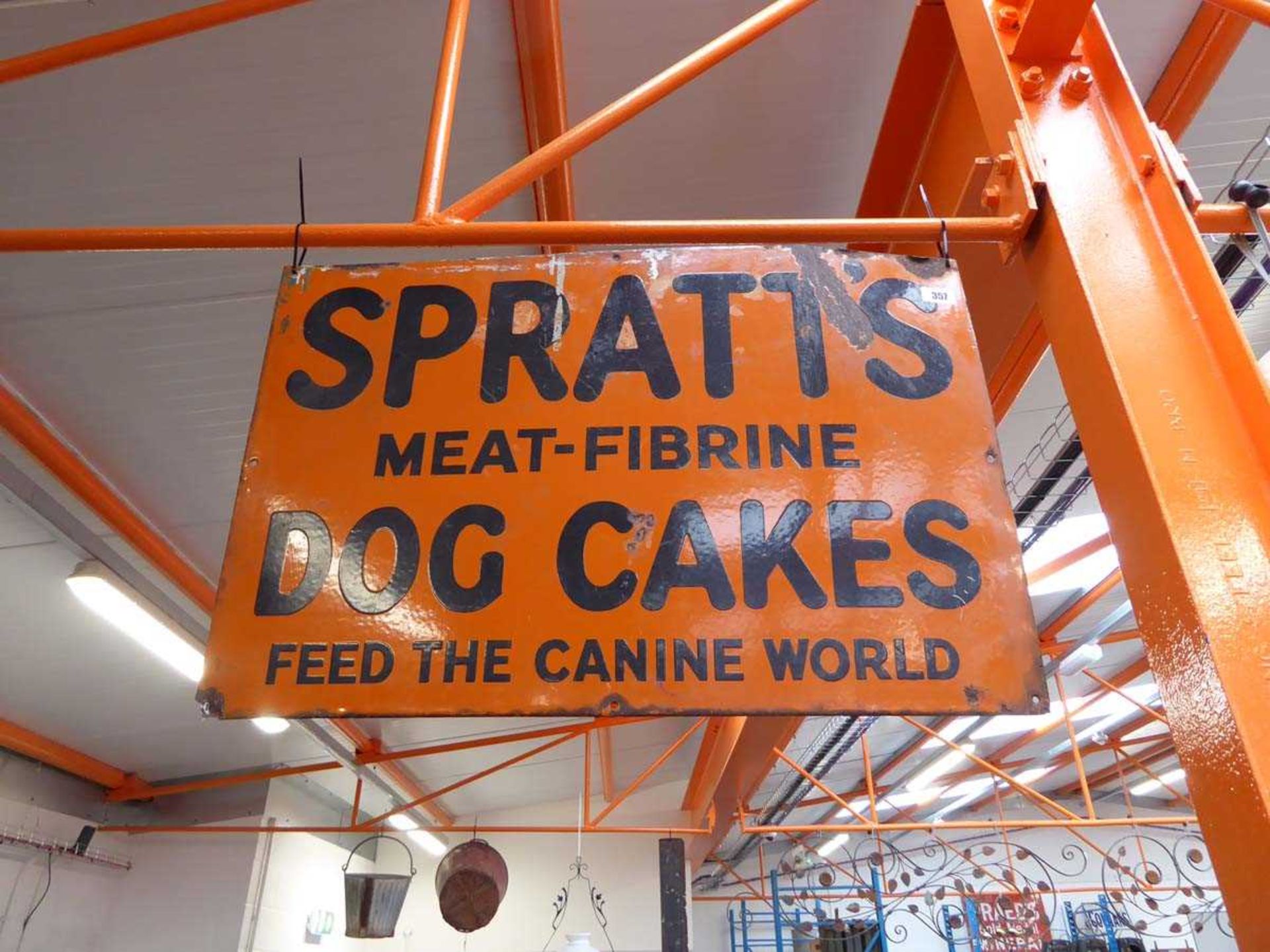 Enamelled metal advertising sign for 'Spratt's Meat-Fibrine Dog Cakes, feed the canine world'