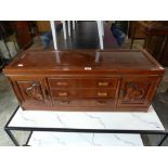 Oriental hard wood entertainment stand with 3 central drawers and 2 small cupboards