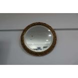 Small gilt framed and bevelled circular wall mirror