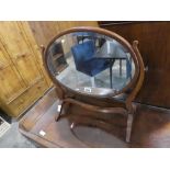 Mahogany framed and bevelled oval toilet mirror