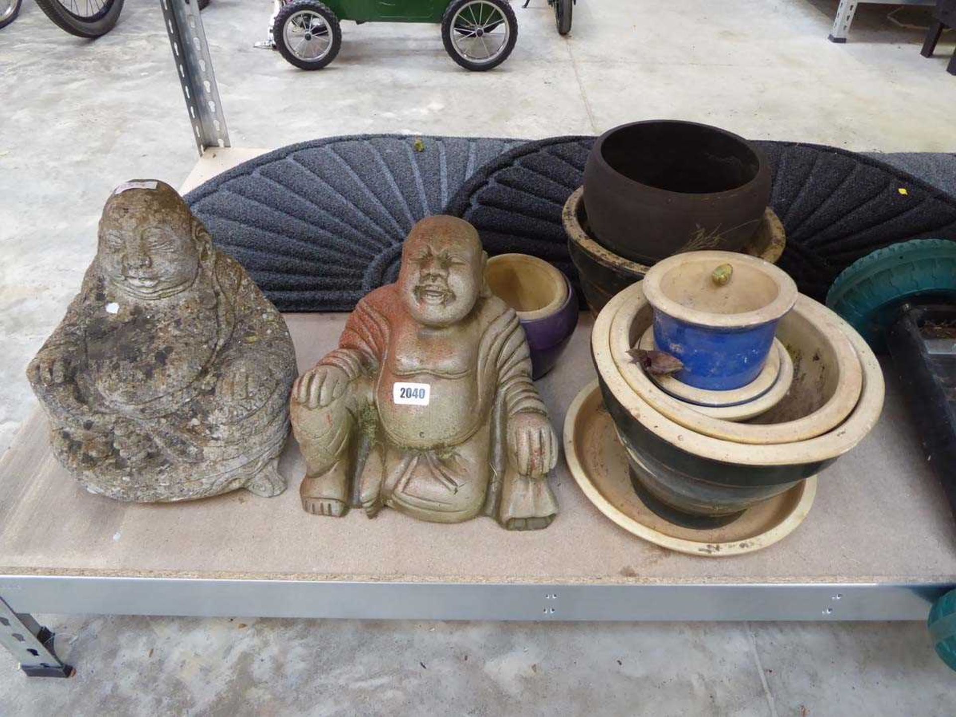 Pair of concrete Buddha statues with ceramic garden pots