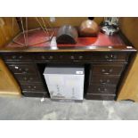 Mahogany twin pedestal office desk with tooled red leather writing surface