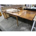 Kofod Larsen for G-Plan; A mid century teak extending dining table