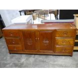 Oriental hard wood sideboard with 2 central doors flanked by 6 drawers