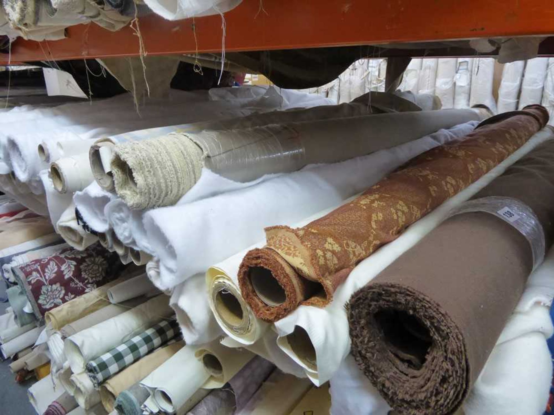 +VAT Shelf of part rolls of curtain fabric