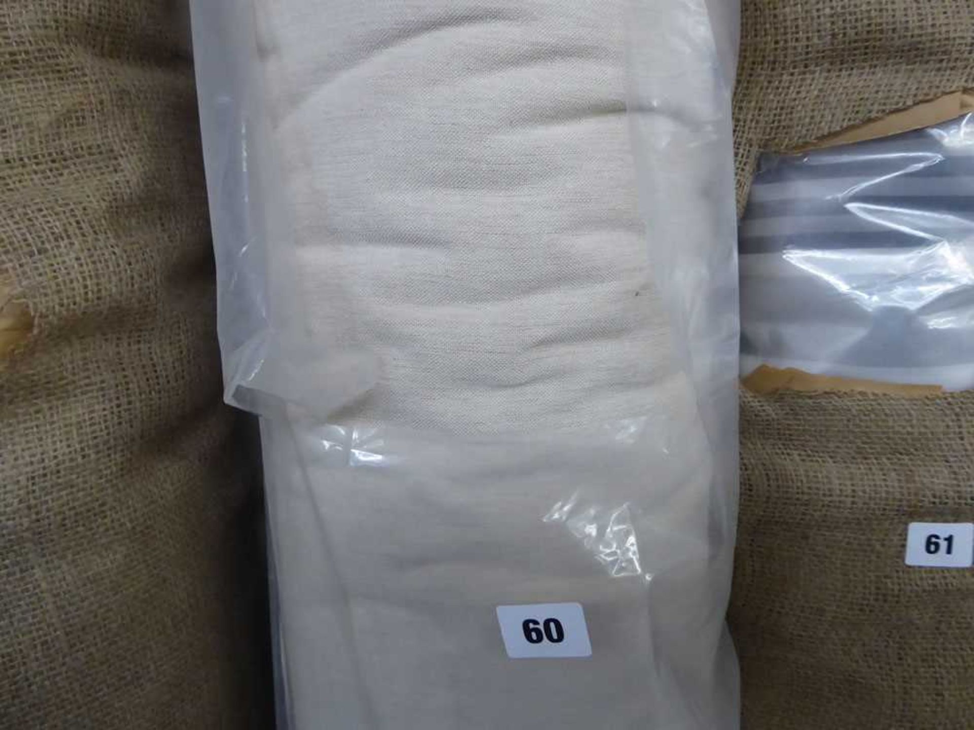 +VAT Roll of cream linen fabric