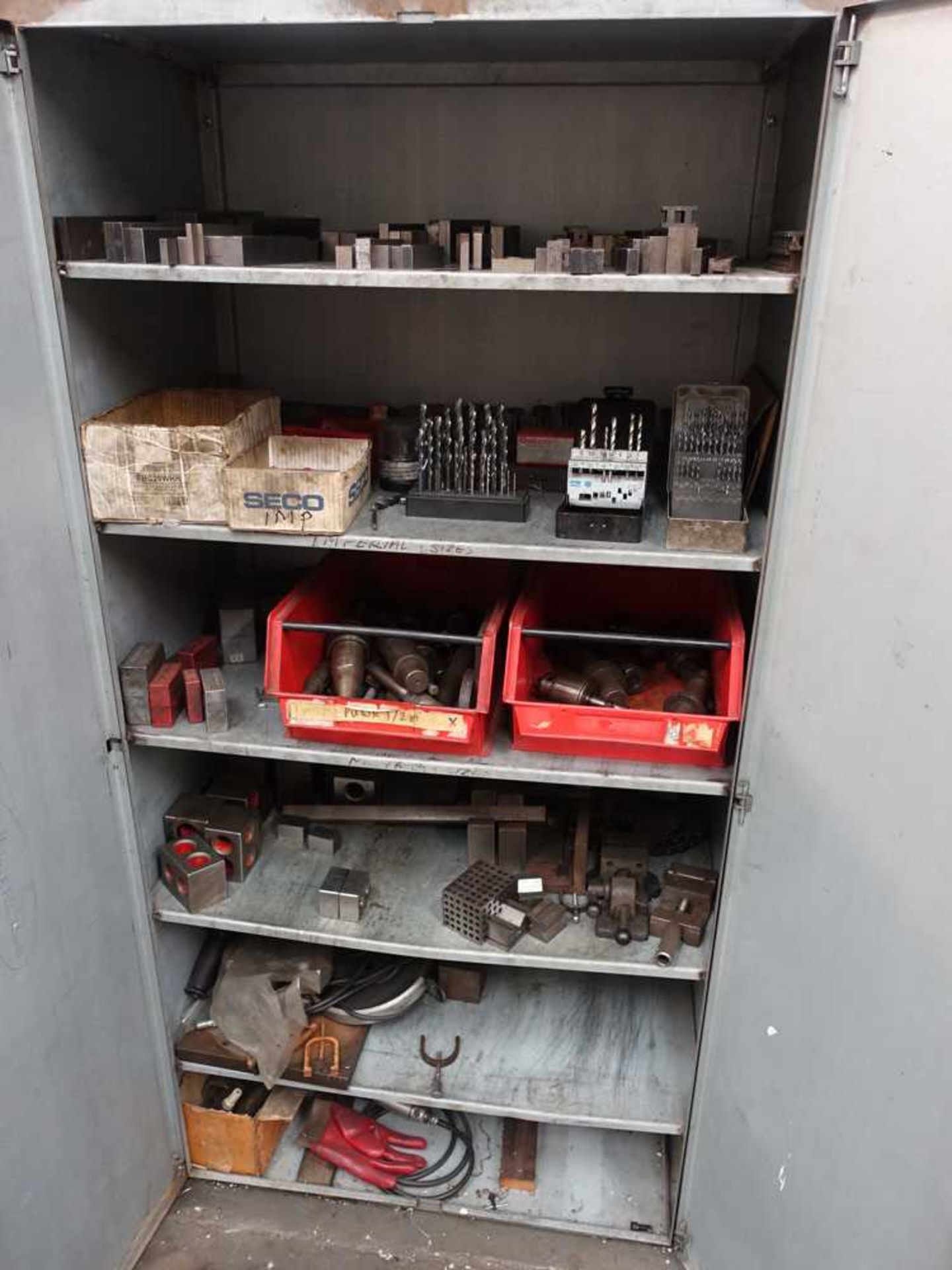 2 door metal cabinet with contents inc. drill bits, machine holders, floating reamers, chucks,