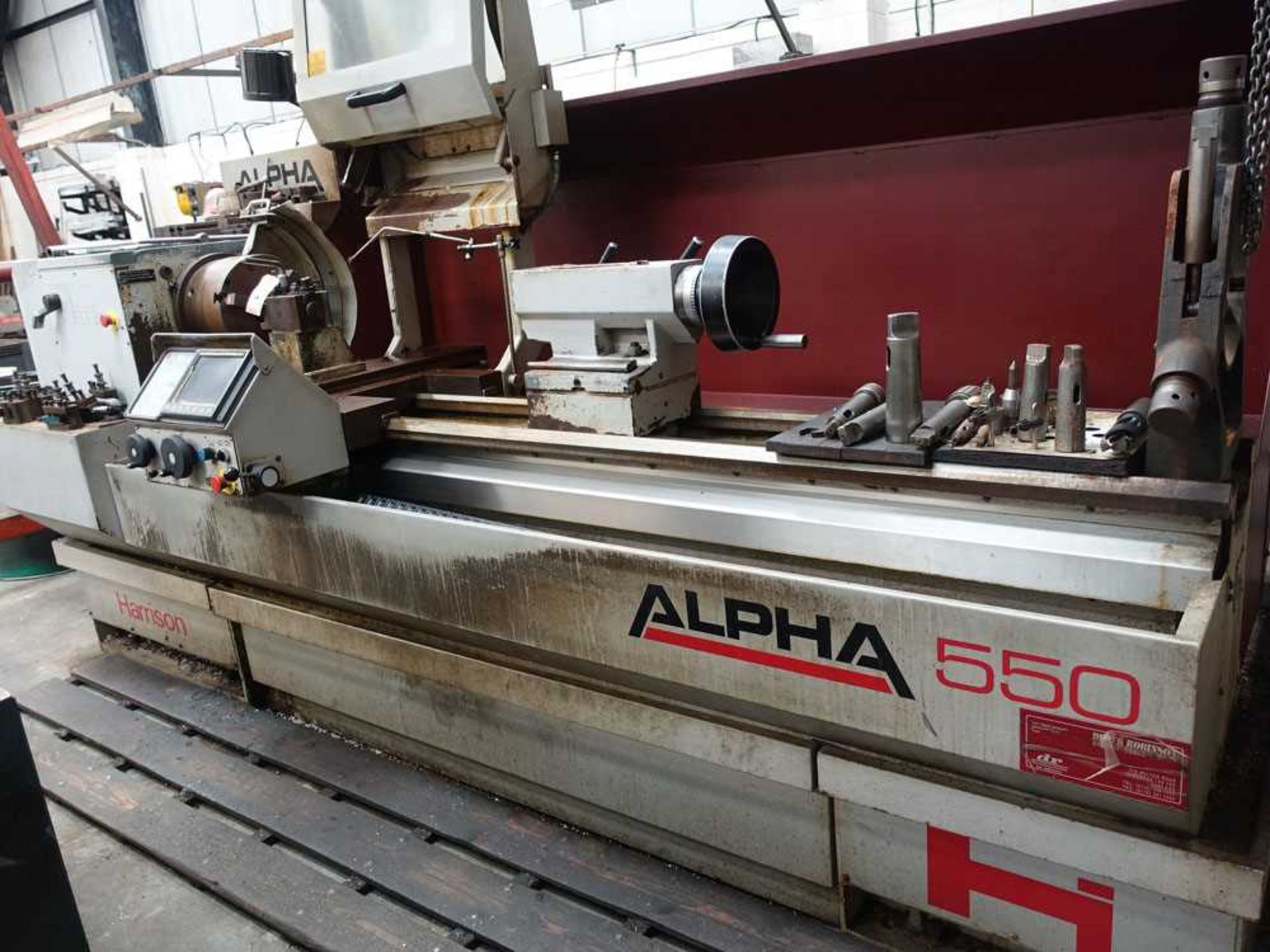 Harrison Alpha 550 CNC lathe, year 1996, serial no: A50140 with 2 x 3 jaw and 1 x 4 jaw chuck,