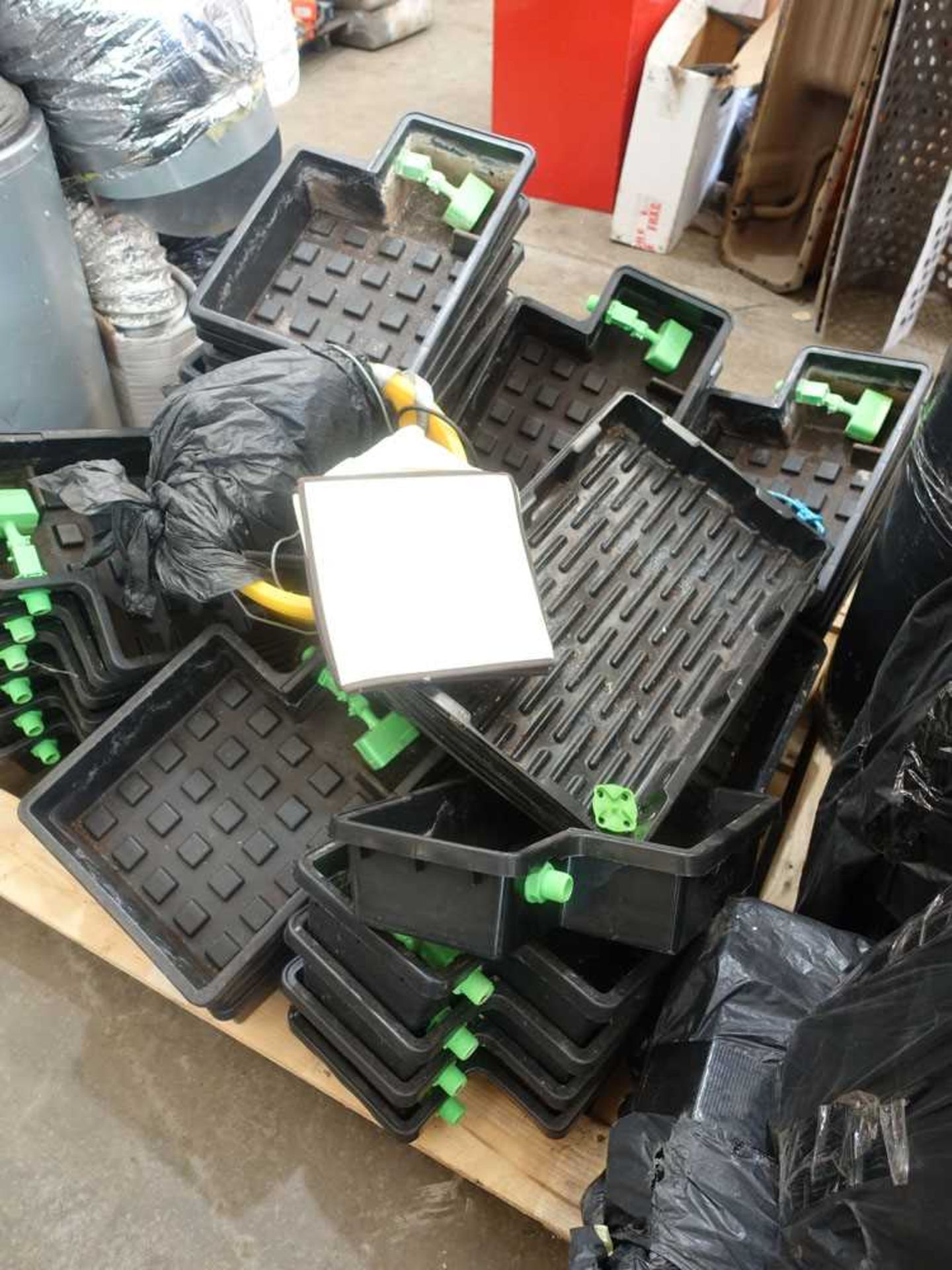+VAT Twelve pallets containing a large quantity of hydroponics equipment, including netting,