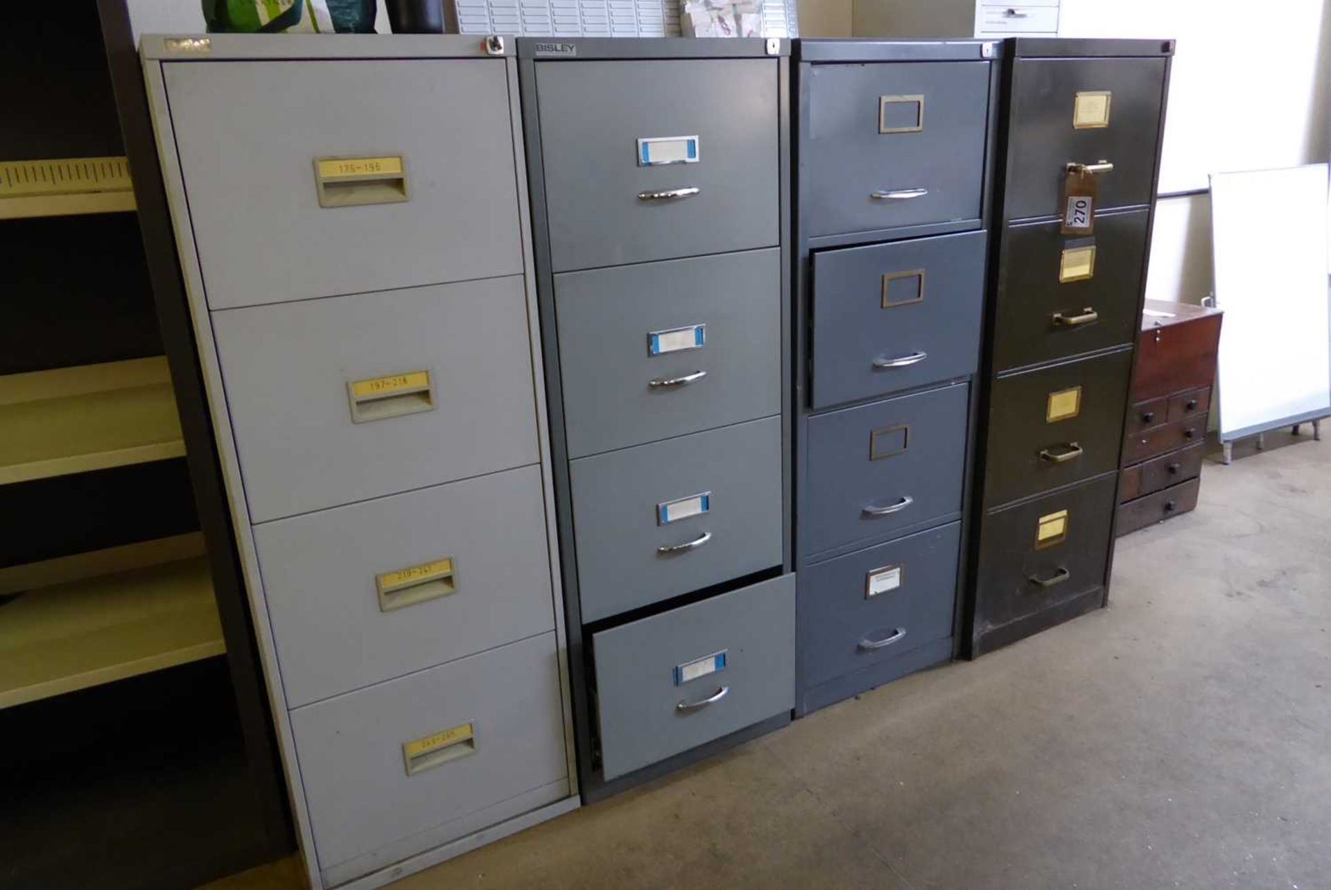 +VAT Remaining furniture in the 2 factory offices comprising 3 grey work stations, 4 steel filing