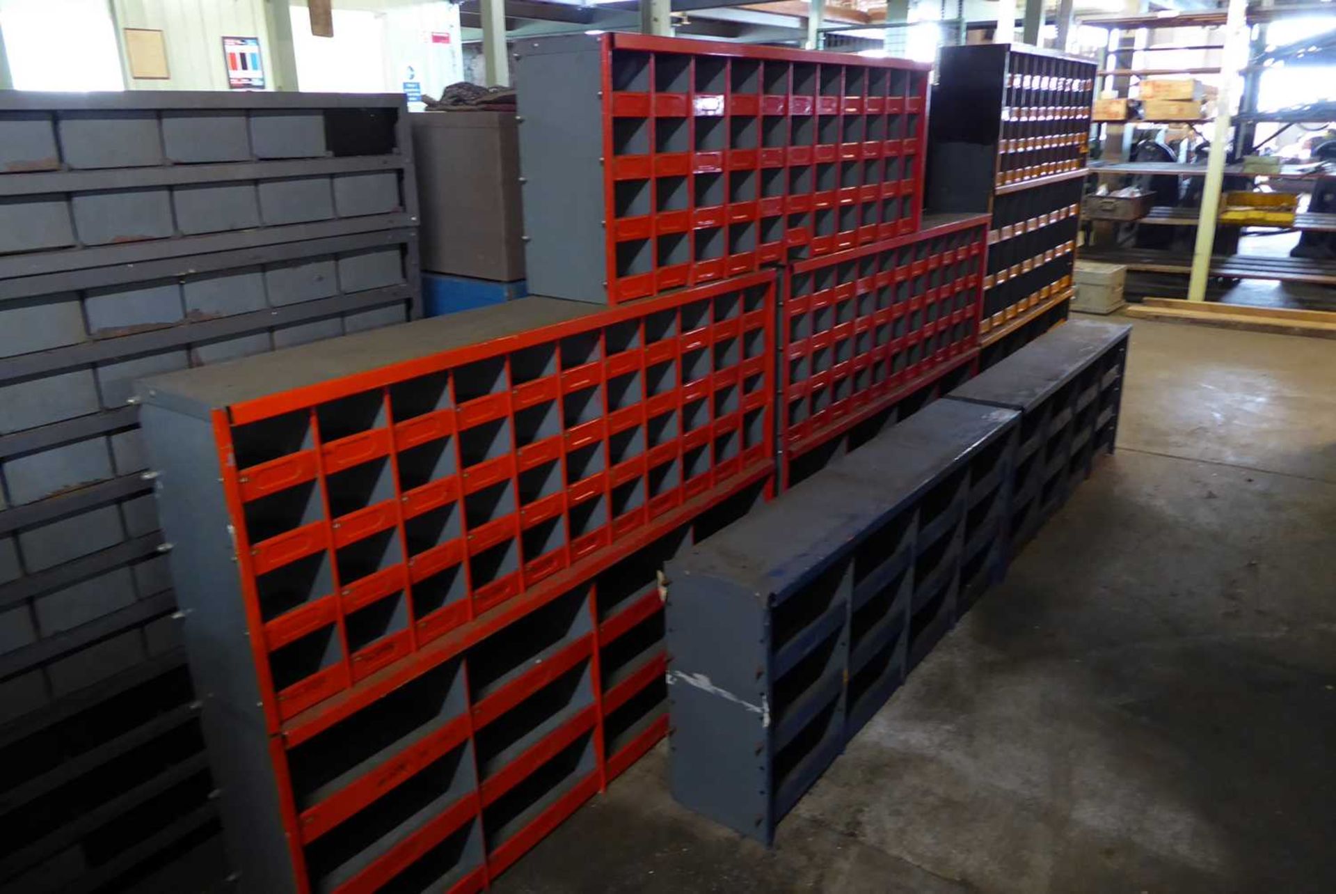 +VAT Orange, blue and red painted pigeon hole racks