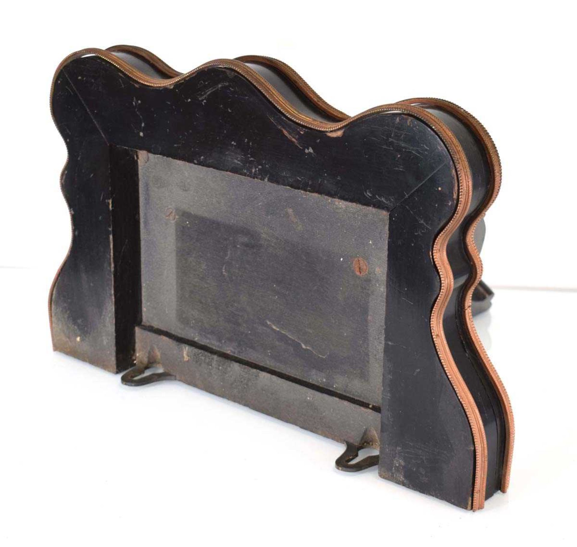 An ebonised and gilt metal mounted clock bracket of serpentine form, w. 46 cm - Image 2 of 2