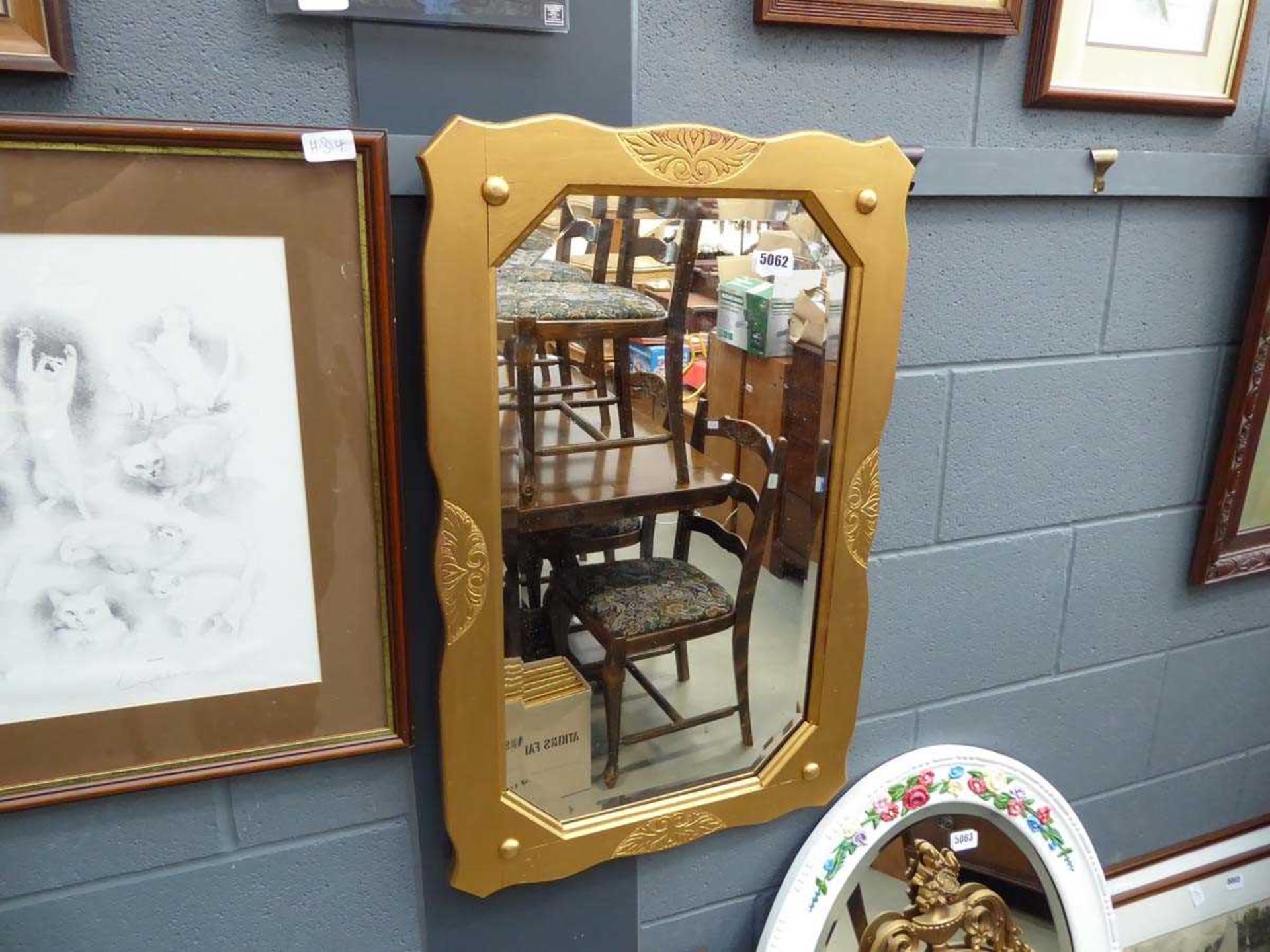Bevelled mirror in gilt frame
