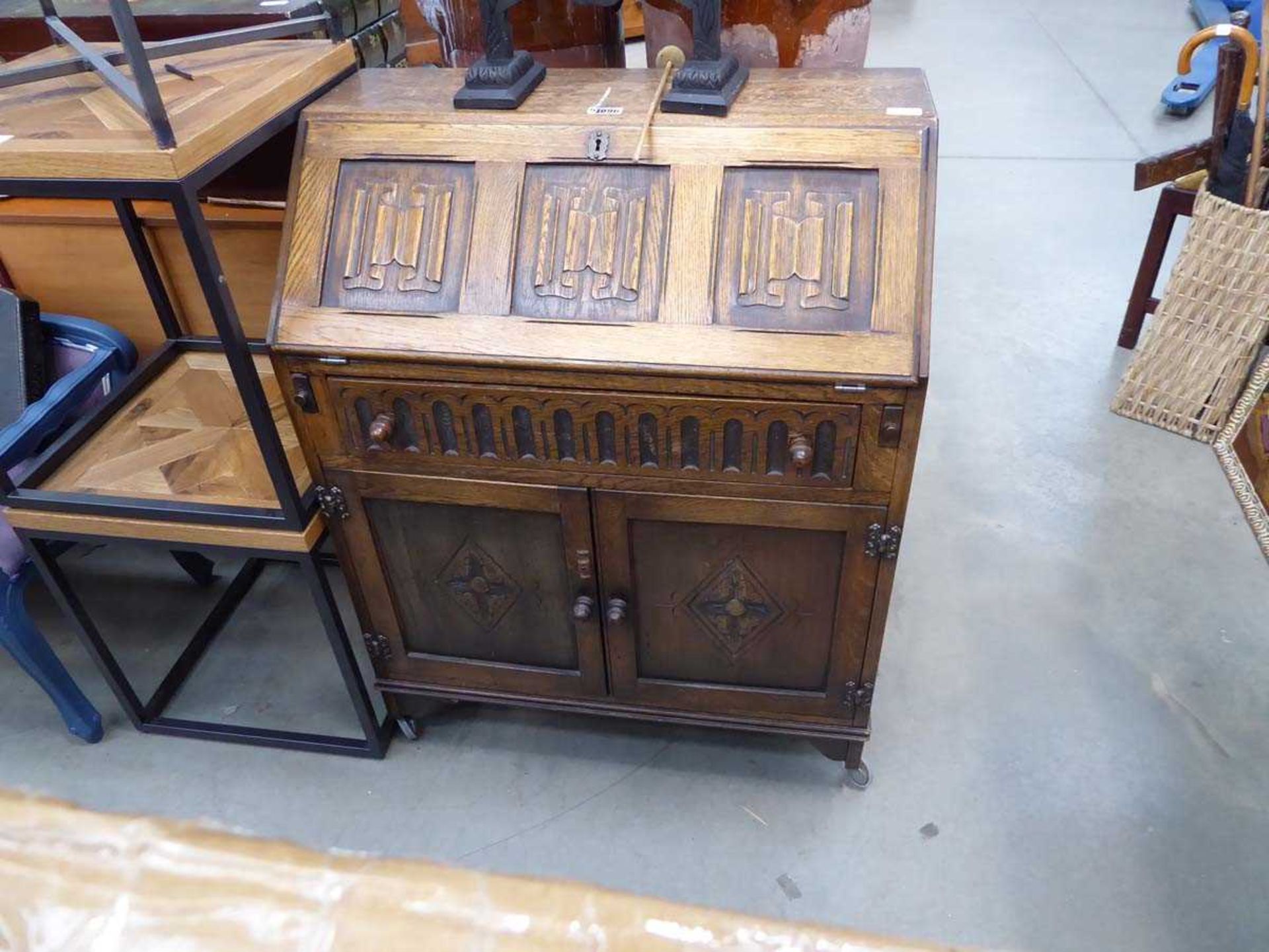 Oak bureau with carved panels