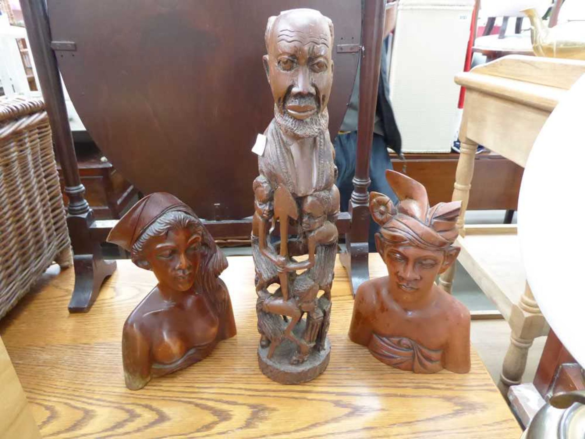 2 carved Balinese figures plus an east African family group