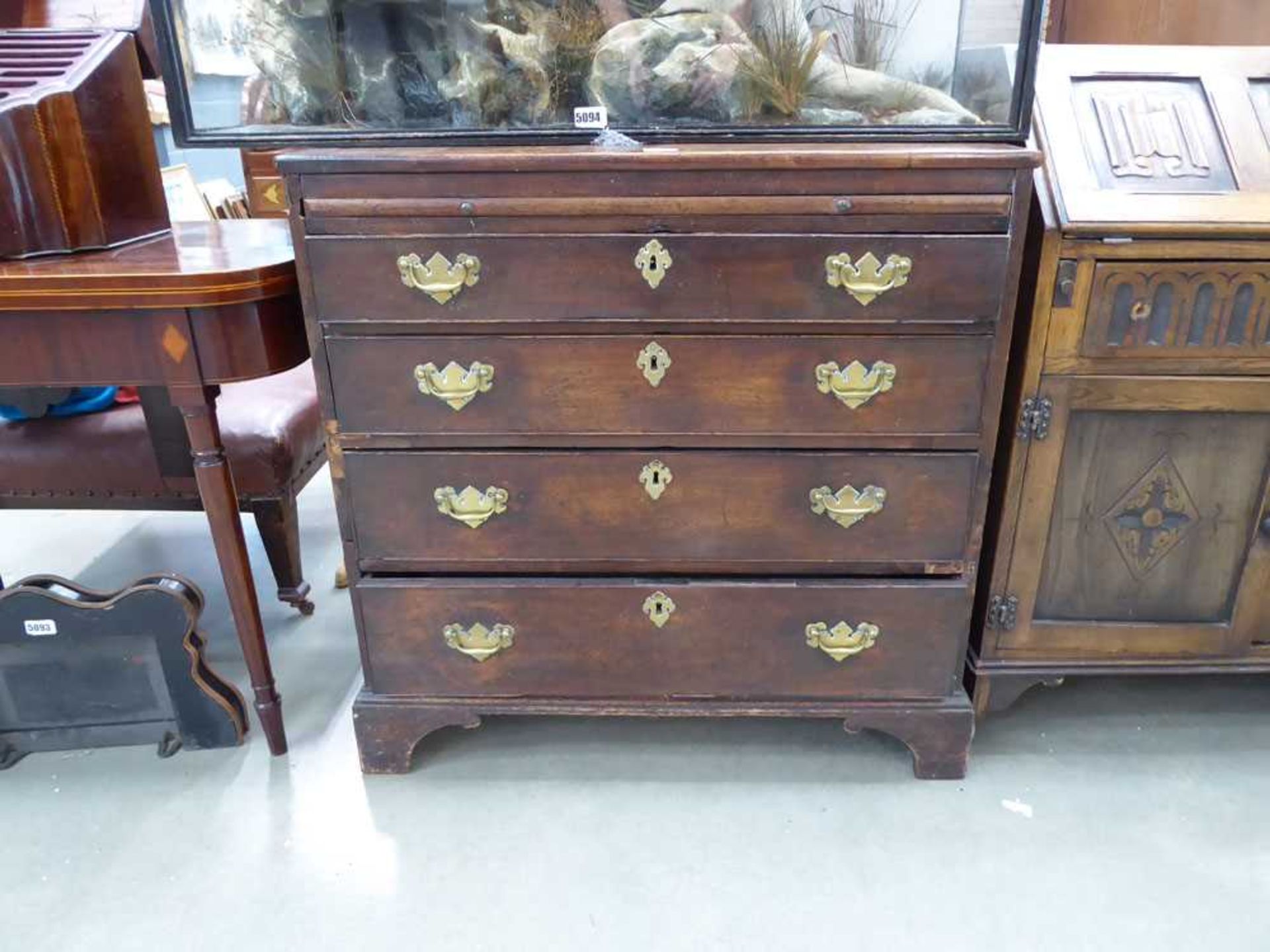 A George III mahogany bachelor's chest, the slide over four long graduated drawers, on bracket feet,