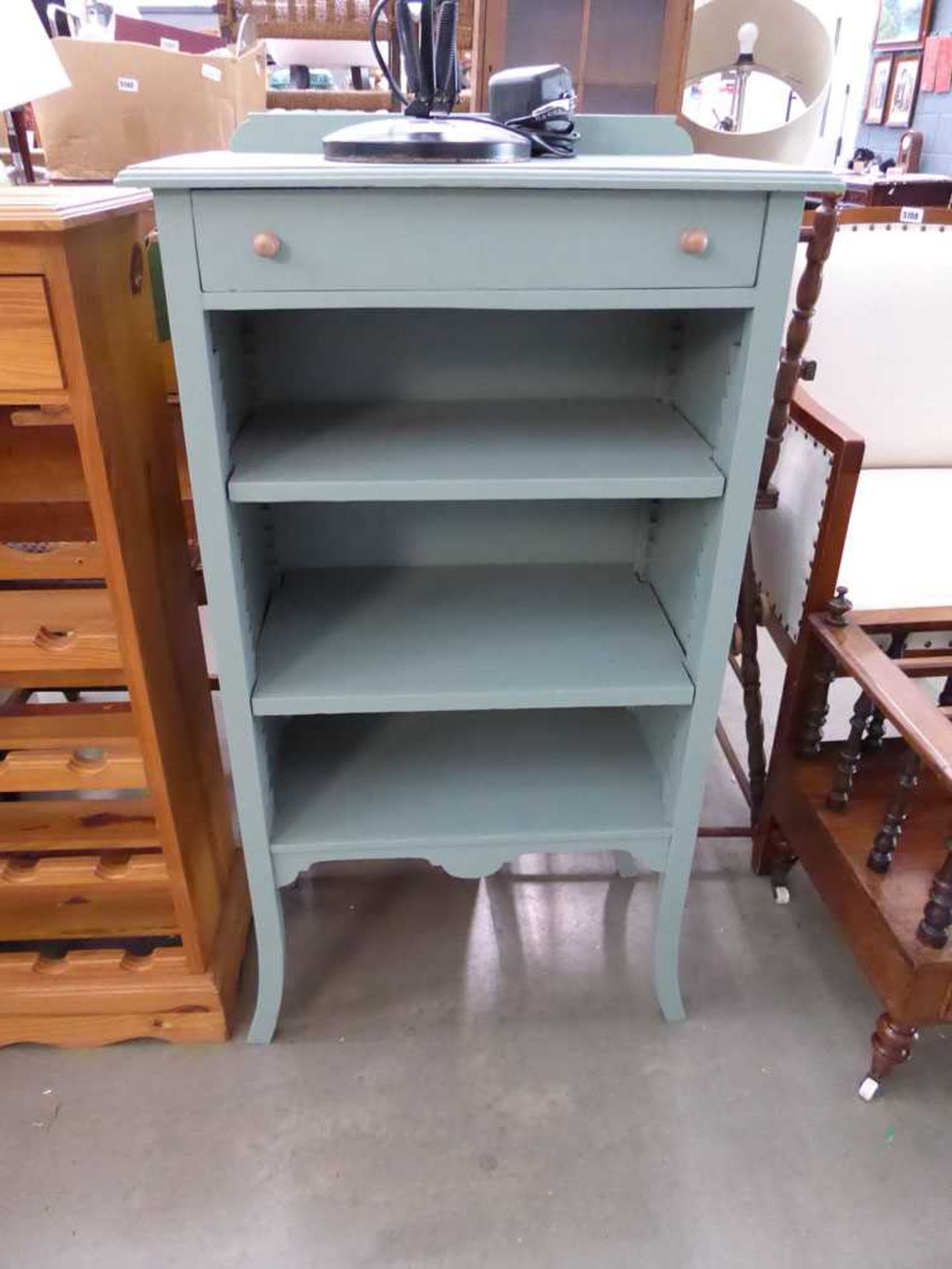 Painted open shelving unit with drawer over