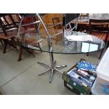 Oval glass table with chromed base