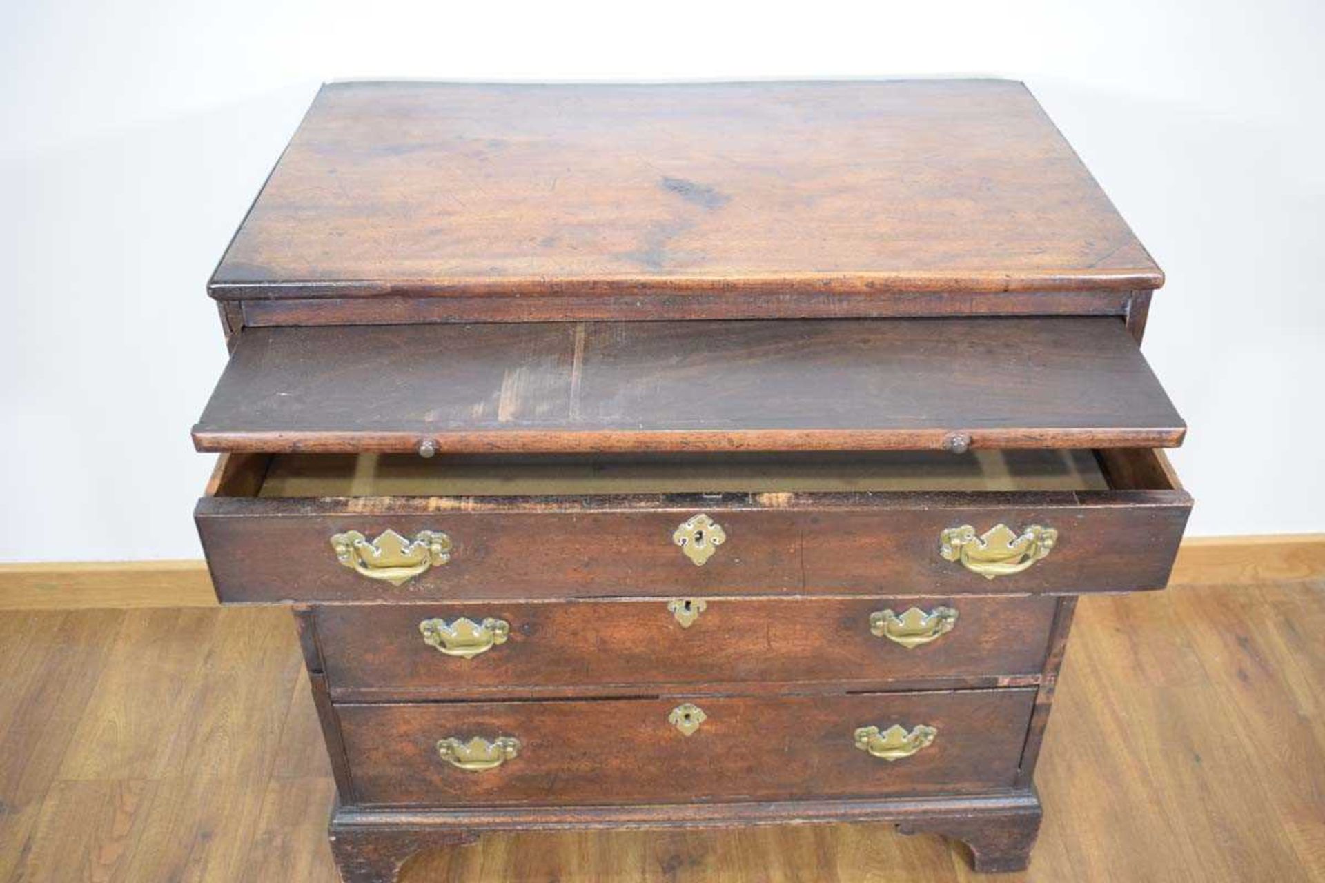 A George III mahogany bachelor's chest, the slide over four long graduated drawers, on bracket feet, - Image 4 of 4