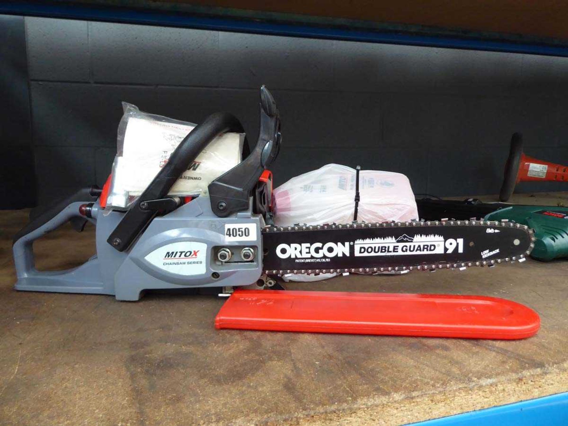 Mitox petrol powered chainsaw and accessories