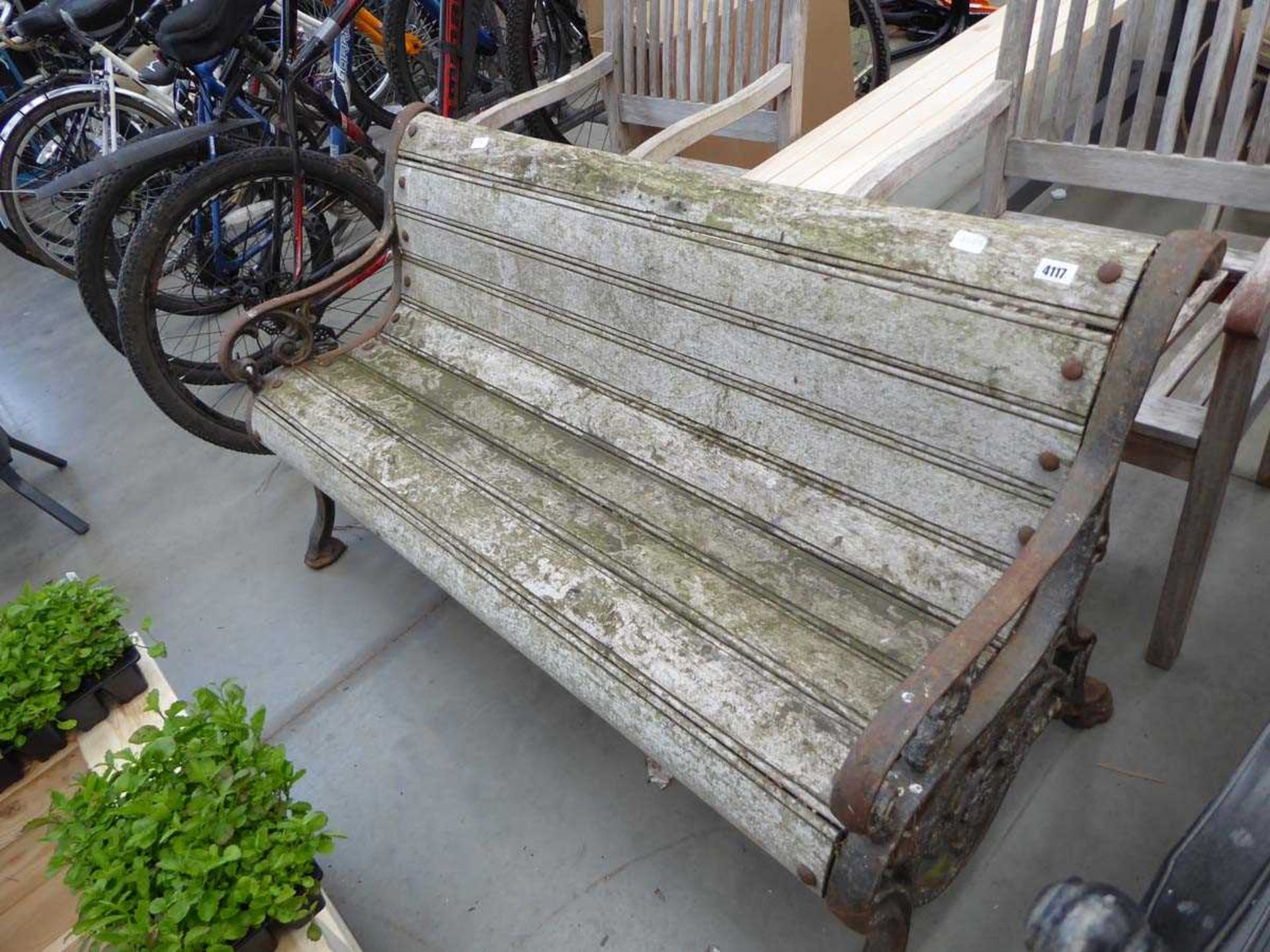 Curved wooden backed metal framed vintage garden bench