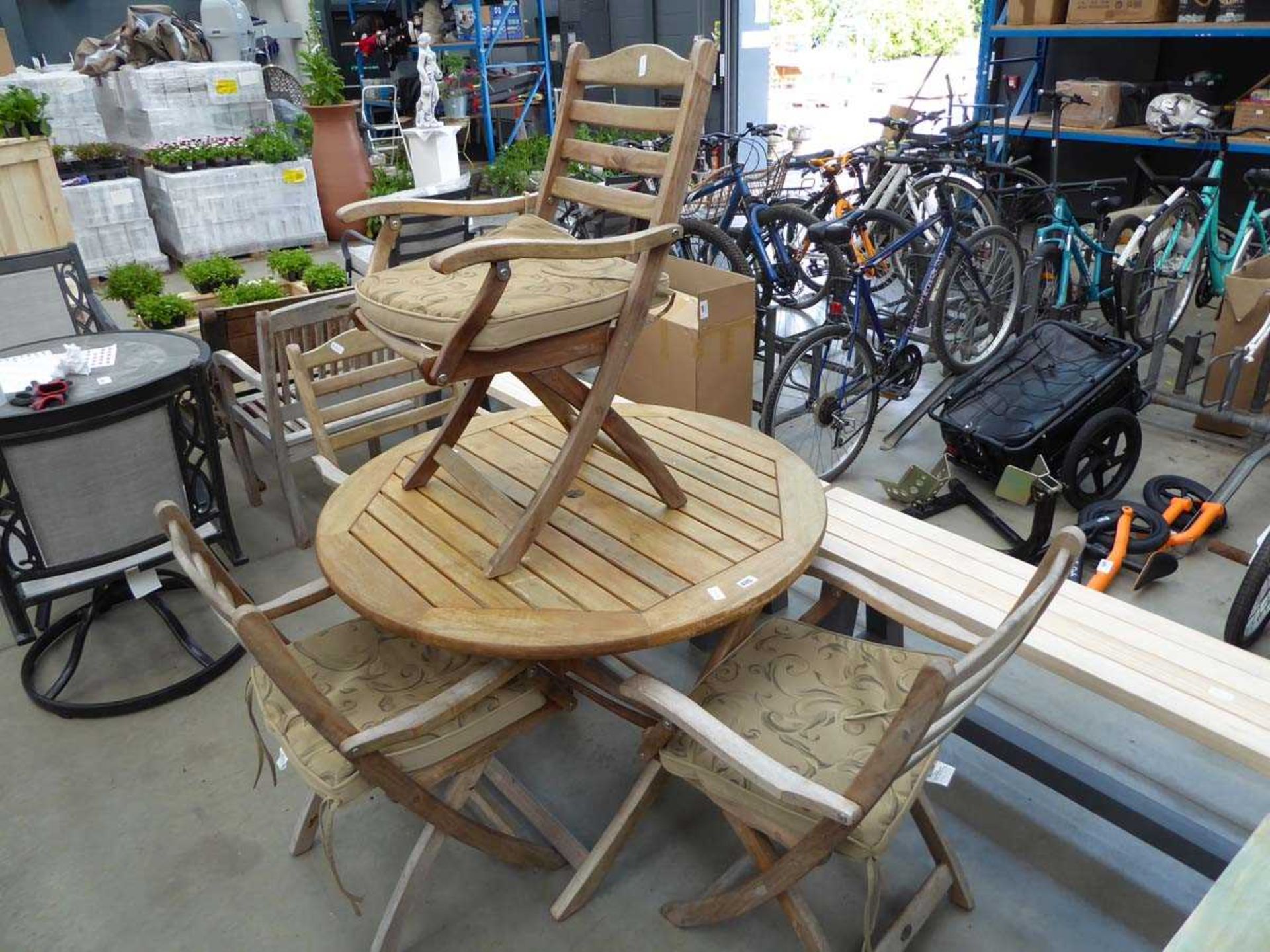 Round fold up garden table complete with 4 matching chairs with brown cushions