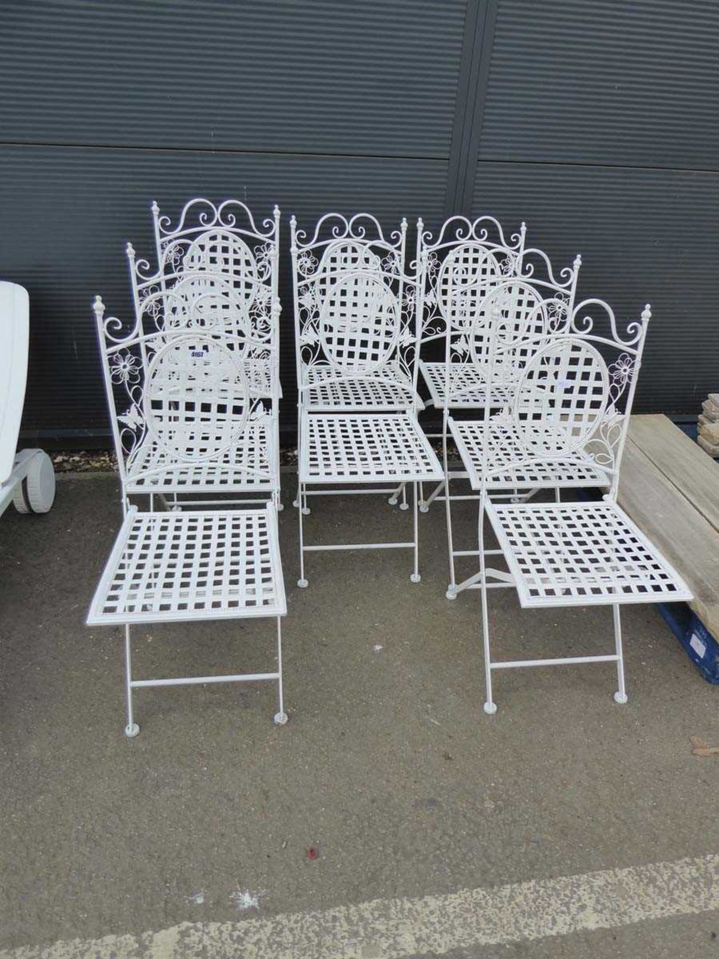 8 white metal fold up garden chairs