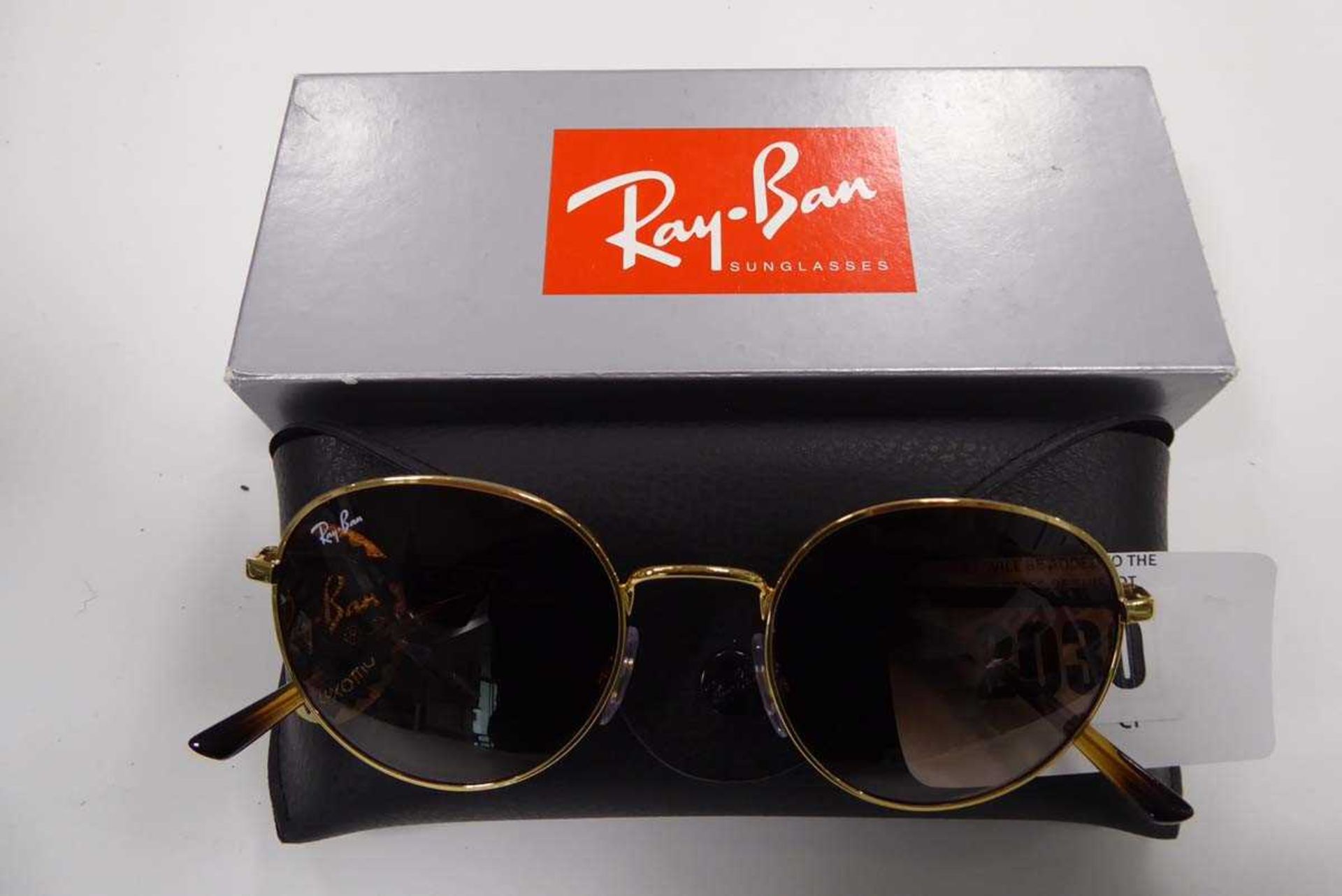 +VAT Pair of Ray-ban sunglasses model no. RB3681001/13 in tortoiseshell with gold coloured rim