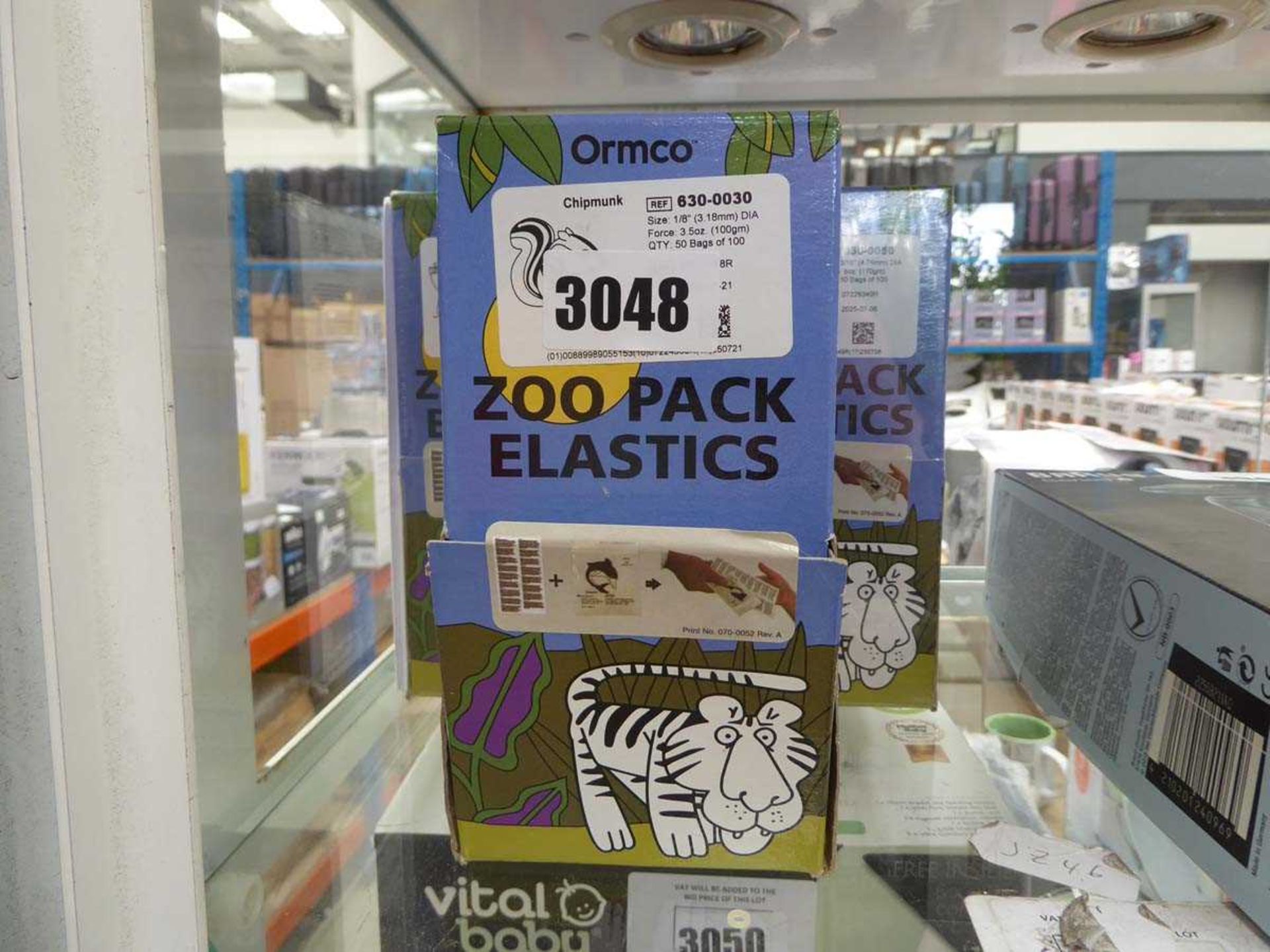 Five boxes of Zoo pack elastics for braces