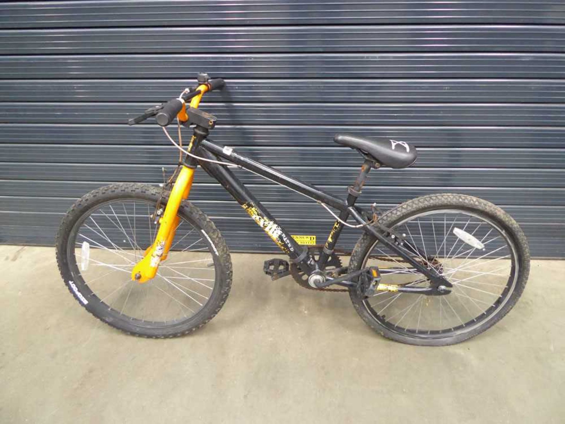 Orange and black child's mountain bike