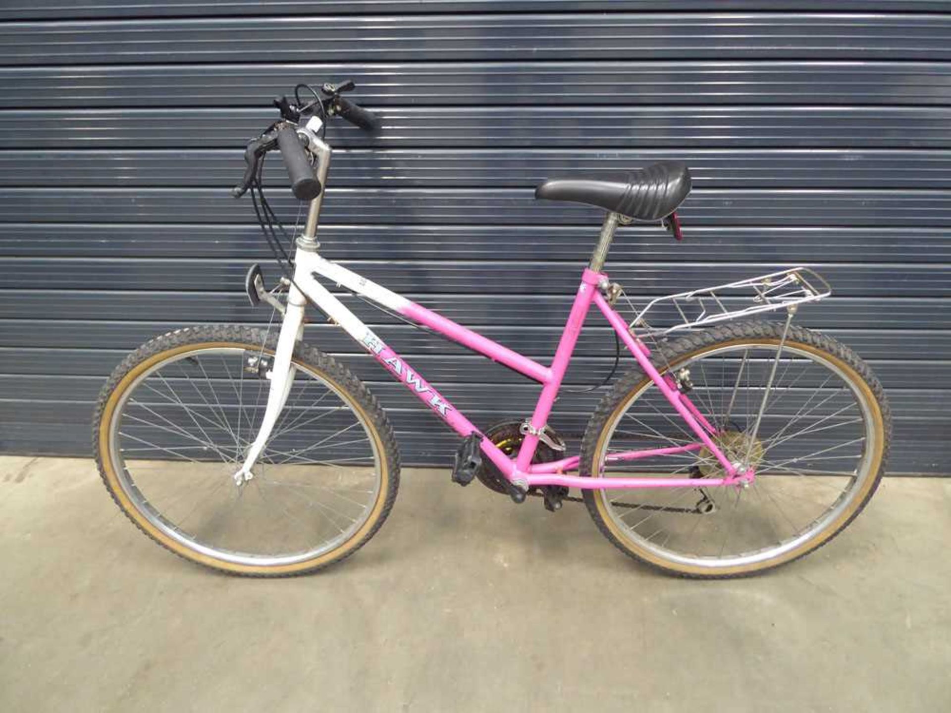 Pink and white ladies bike