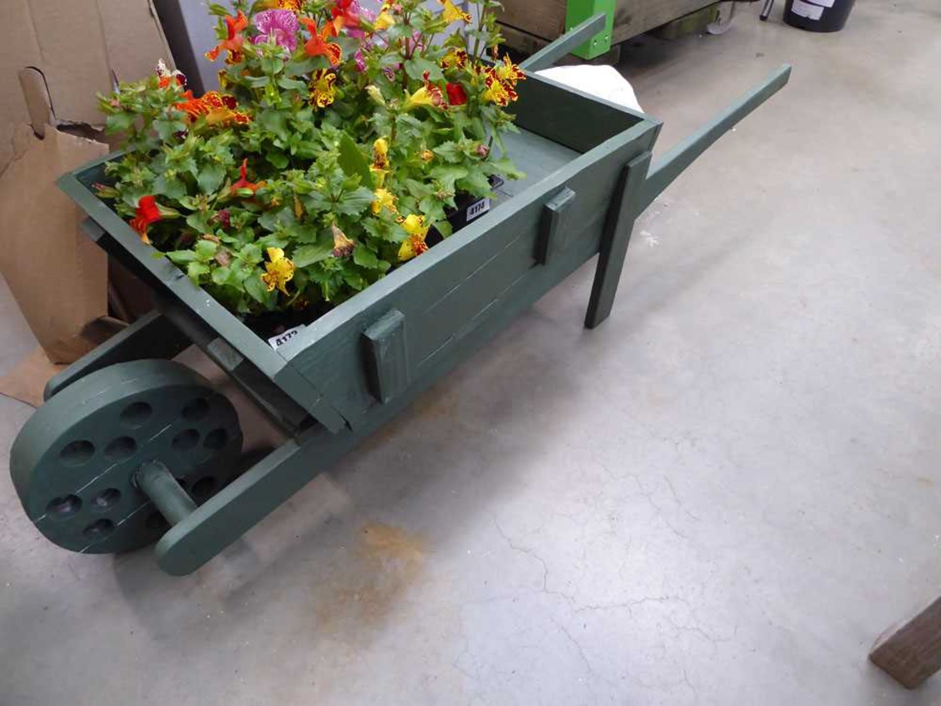 Wooden painted ornamental wheelbarrow