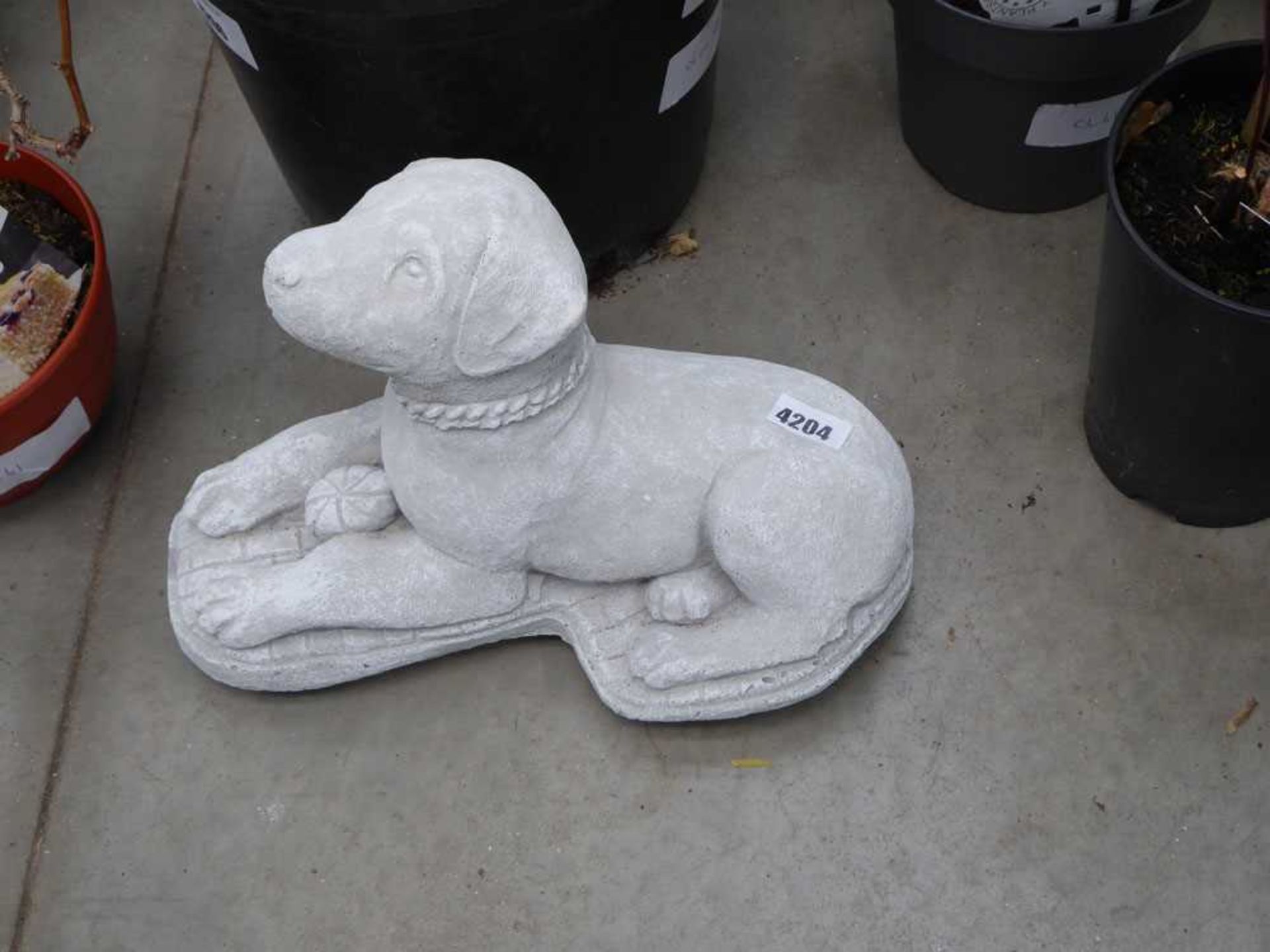 Concrete statue of a puppy