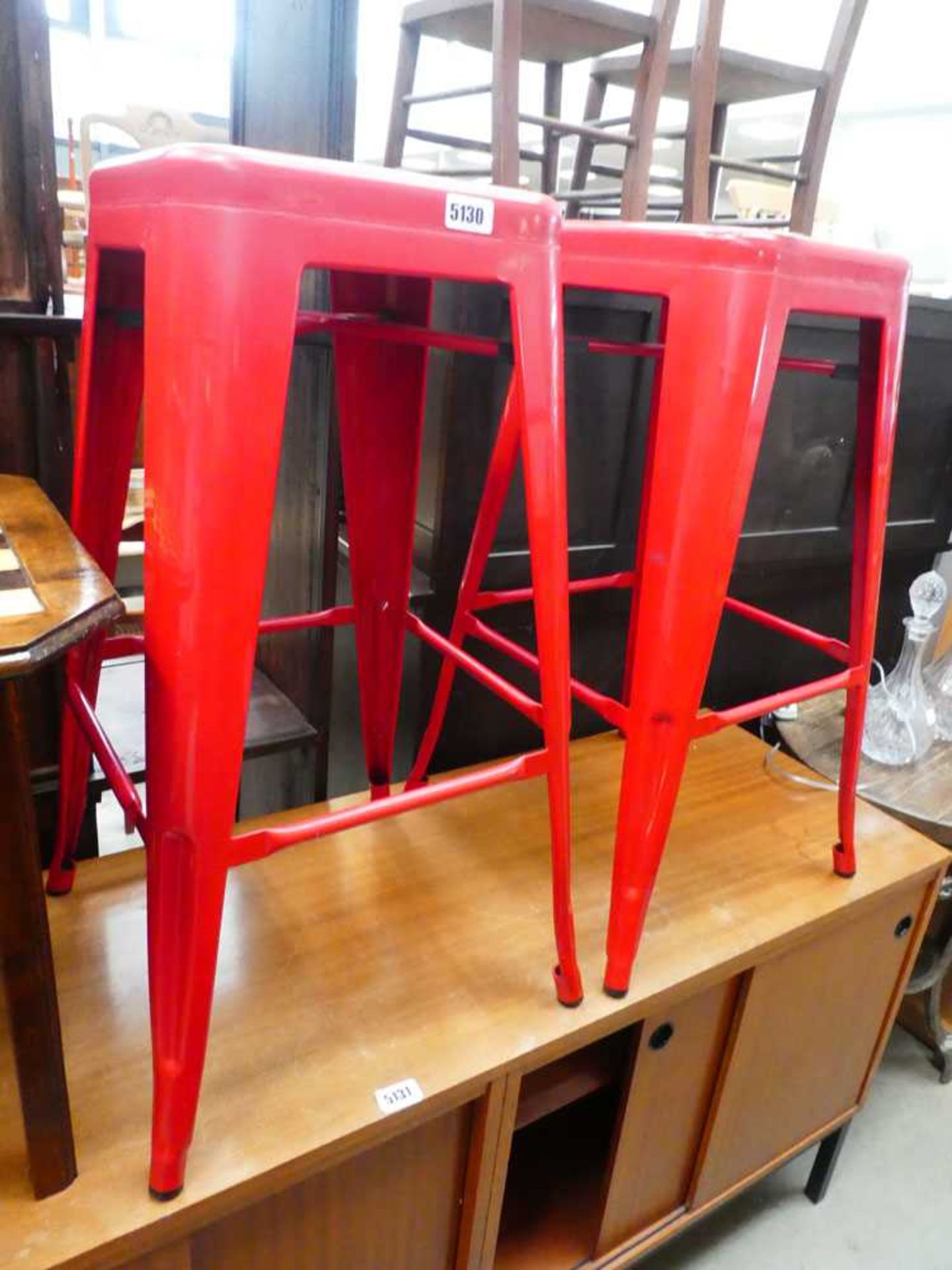 Pair of red painted metal stools