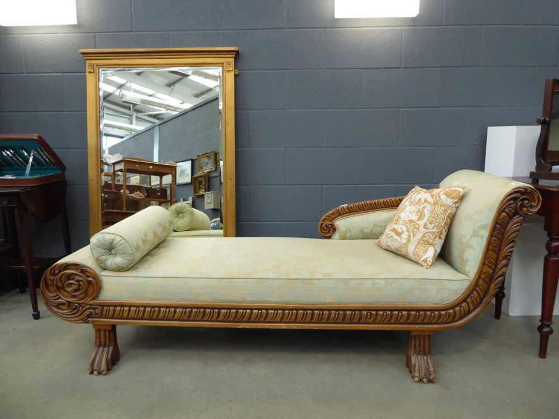 Chaise lounge with carved frame